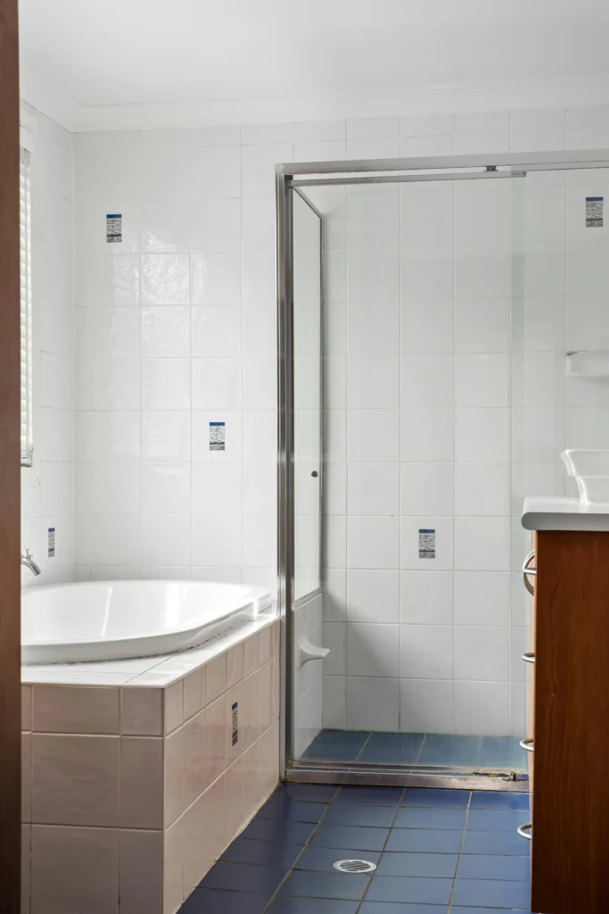 Stylish wall and floor upgrades in budget bathrooms by Bathroom Renovations Wellington, designed for affordability.