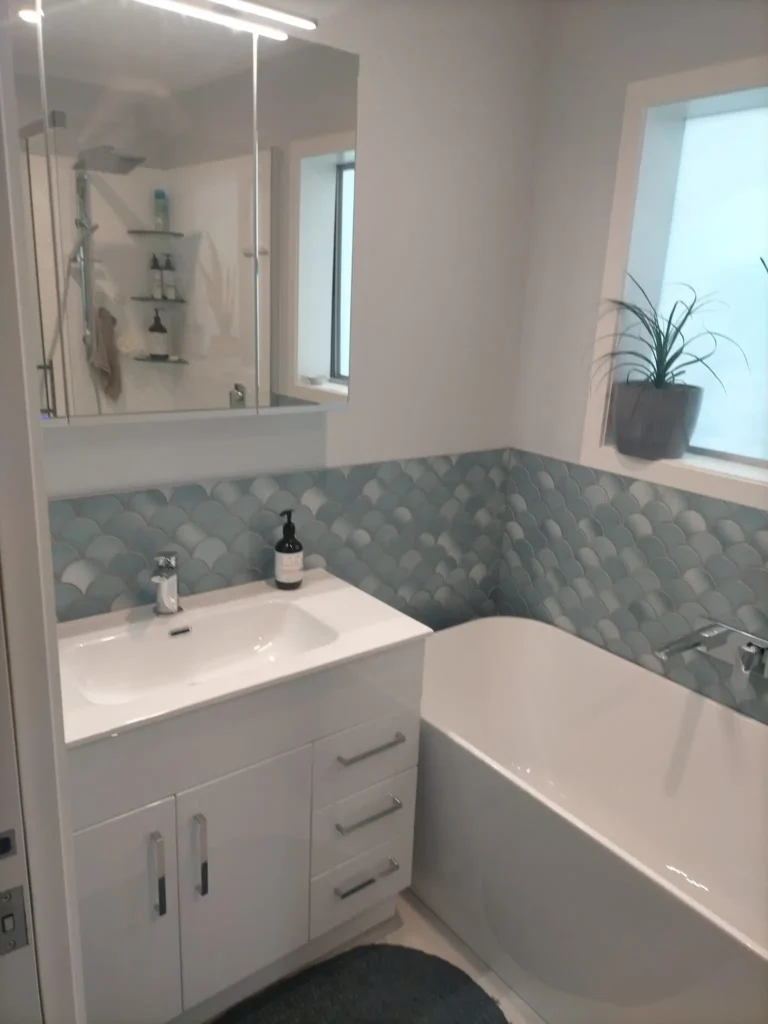 Expert team from Bathroom Renovations Wellington working on stylish small bathroom renovations in a compact space.